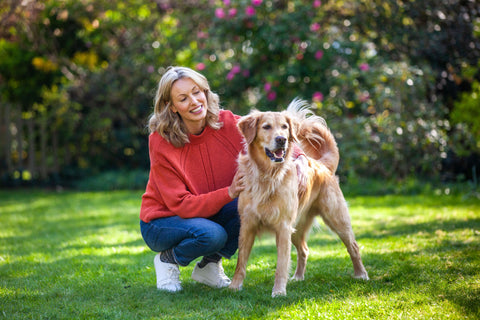 Owner and dog in the garden